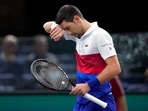 Novak Djokovic of Serbia reacts after missing a ball against U.S. Taylor Fritz during their quarterfinal match at the Paris Masters tennis tournament at the Accor Arena, in Paris, France, Friday, Nov. 5, 2021. (AP) Novak Djokovic of Serbia reacts after missing a ball against U.S. Taylor Fritz during their quarterfinal match at the Paris Masters tennis tournament at the Accor Arena, in Paris, France, Friday, Nov. 5, 2021. (AP)