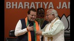 File photo of BJP leader Arvind Sharma with former Haryana chief minister Manohar Lal Khattar. (HT file photo) File photo of BJP leader Arvind Sharma with former Haryana chief minister Manohar Lal Khattar. (HT file photo)