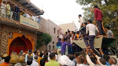 BJP leader Manish Grover and others were allegedly kept hostage by farmers for several hours at the Shiva temple in Rohtak's Kiloi village (Manoj Dhaka/ Hindustan Times) BJP leader Manish Grover and others were allegedly kept hostage by farmers for several hours at the Shiva temple in Rohtak's Kiloi village (Manoj Dhaka/ Hindustan Times)