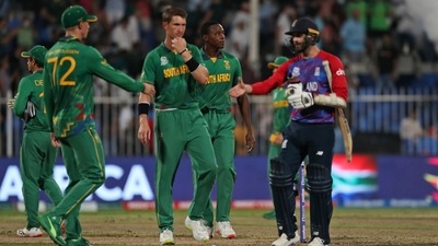 England's Mark Wood walks to congratulate South African cricketers after the latter won the Cricket Twenty20 World Cup match in Sharjah, UAE, Saturday, Nov. 6, 2021. (AP) England's Mark Wood walks to congratulate South African cricketers after the latter won the Cricket Twenty20 World Cup match in Sharjah, UAE, Saturday, Nov. 6, 2021. (AP)