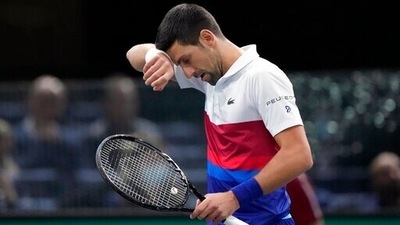 Novak Djokovic of Serbia reacts after missing a ball against U.S. Taylor Fritz during their quarterfinal match at the Paris Masters tennis tournament at the Accor Arena, in Paris, France, Friday, Nov. 5, 2021. (AP) Novak Djokovic of Serbia reacts after missing a ball against U.S. Taylor Fritz during their quarterfinal match at the Paris Masters tennis tournament at the Accor Arena, in Paris, France, Friday, Nov. 5, 2021. (AP)