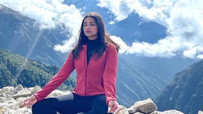 Here she is, posing for the camera, or perhaps trying to meditate. Here she is, posing for the camera, or perhaps trying to meditate.