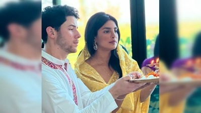Priyanka Chopra donned a beautiful yellow printed saree while Nick Jonas looked dapper in his white kurta pyjama with red neck borders. (Instagram/@priyankachopra) Priyanka Chopra donned a beautiful yellow printed saree while Nick Jonas looked dapper in his white kurta pyjama with red neck borders. (Instagram/@priyankachopra)