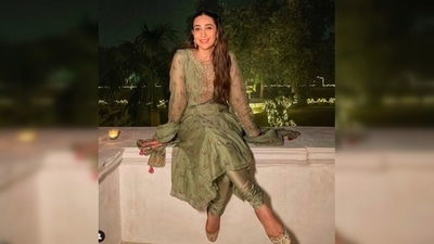 Karisma Kapoor opted for a mehendi green embellished salwar suit by designer Anita Dongre which she teamed with sequins juttis and statement earrings. (Instagram/@therealkarismakapoor) Karisma Kapoor opted for a mehendi green embellished salwar suit by designer Anita Dongre which she teamed with sequins juttis and statement earrings. (Instagram/@therealkarismakapoor)