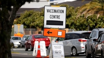A vaccination centre sign directs the public during a lockdown to curb the spread of a coronavirus disease (Covid-19) outbreak in Auckland, New Zealand. (REUTERS/Fiona Goodall/File Photo) (REUTERS)