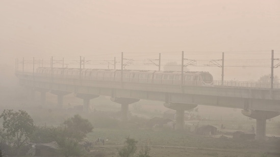 Metro train passes through dense smog after Diwali, in New Delhi&nbsp;(ANI Photo)