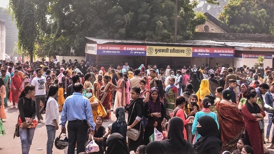 Women wait outside District Jail for their brothers serving a sentence in the prison on the occasion of Bhai Dooj festival, in Kanpur.(PTI)