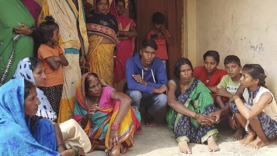 Inconsolable family members and relatives of victims after ten people died due to consumption of suspected spurious liquor, in Gopalganj district. (PTI Photo) Inconsolable family members and relatives of victims after ten people died due to consumption of suspected spurious liquor, in Gopalganj district. (PTI Photo)