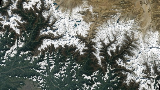 This image collected by Landsat 9 on October 31, 2021 and released by NASA, shows the city of Kathmandu, Nepal, seen at the bottom left, lies in a valley south of the Himalayan Mountains between Nepal and China. - Glaciers, and the lakes formed by glacial meltwater, are visible in the top middle of this image. In High Mountain Asia, many communities rely on meltwater from glaciers � and Landsat can help track how those glaciers are changing in a warming climate. Previous studies with Landsat have documented shrinkage of Himalayan glaciers, as well as changing lake levels the adjacent Tibetan plateau. (Photo by Handout / various sources / AFP) This image collected by Landsat 9 on October 31, 2021 and released by NASA, shows the city of Kathmandu, Nepal, seen at the bottom left, lies in a valley south of the Himalayan Mountains between Nepal and China. - Glaciers, and the lakes formed by glacial meltwater, are visible in the top middle of this image. In High Mountain Asia, many communities rely on meltwater from glaciers � and Landsat can help track how those glaciers are changing in a warming climate. Previous studies with Landsat have documented shrinkage of Himalayan glaciers, as well as changing lake levels the adjacent Tibetan plateau. (Photo by Handout / various sources / AFP) 