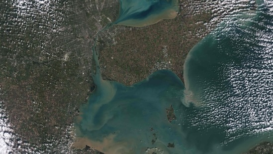 This image collected by Landsat 9 on October 31, 2021, and released by NASA, shows sediments swirling in Lake Erie and Lake St. Clair in this image of both Detroit, Michigan, and Windsor, Ontario. - The Great Lakes serve as sources of fresh water, recreational activity, transport, and habitat for the upper-midwestern United States, and water quality remains a high priority. In warmer months, Landsat 9 observes swirls of green algae which can become harmful algal blooms. (Photo by Handout / various sources / AFP) This image collected by Landsat 9 on October 31, 2021, and released by NASA, shows sediments swirling in Lake Erie and Lake St. Clair in this image of both Detroit, Michigan, and Windsor, Ontario. - The Great Lakes serve as sources of fresh water, recreational activity, transport, and habitat for the upper-midwestern United States, and water quality remains a high priority. In warmer months, Landsat 9 observes swirls of green algae which can become harmful algal blooms. (Photo by Handout / various sources / AFP)