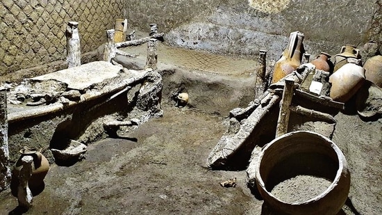 A “slaves room” at a Roman villa, containing beds, amphorae, ceramic pitchers and a chamber pot is discovered in a dig near the ancient Roman city of Pompeii(AP)