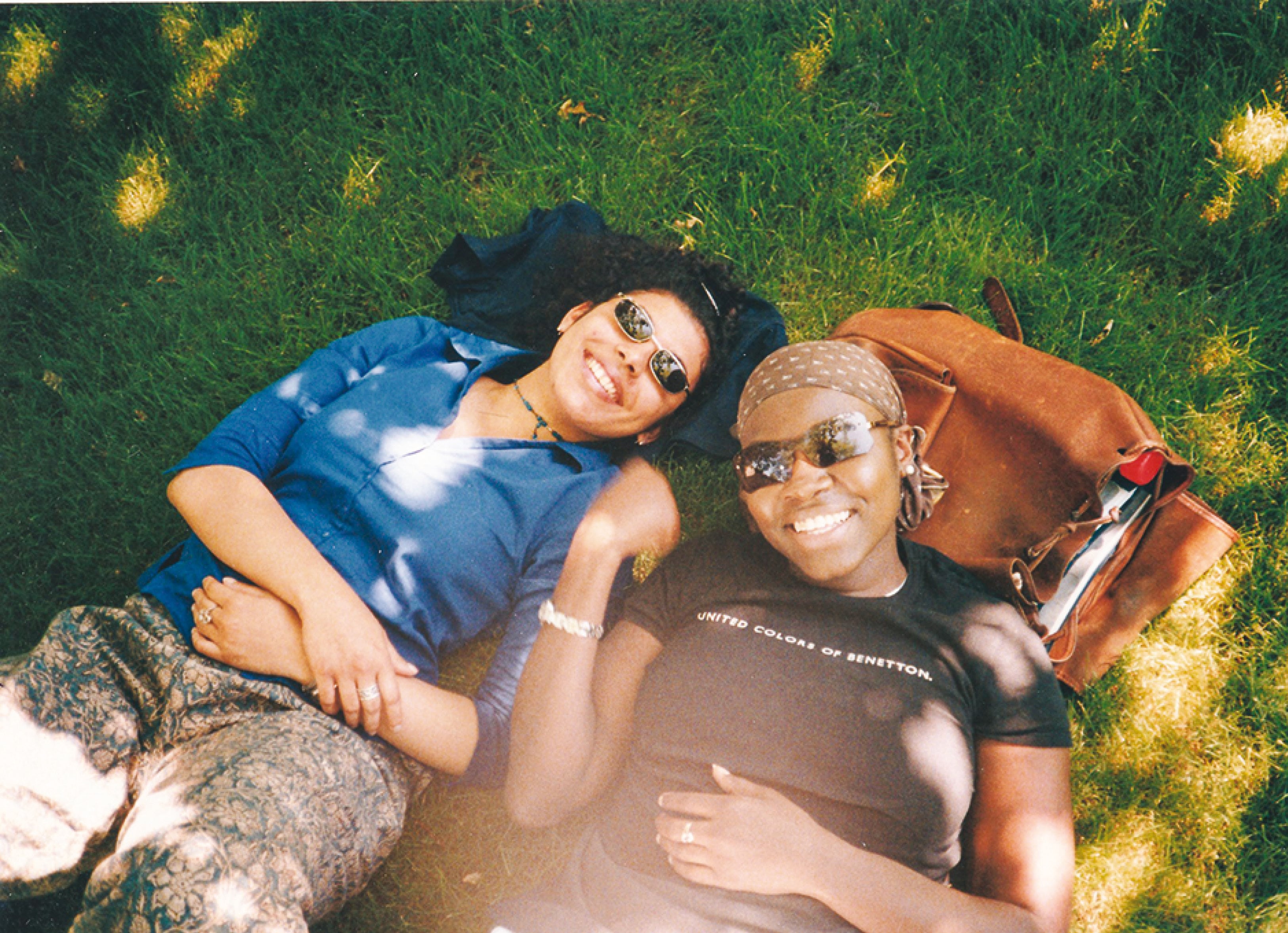 With her friend Shirine (right), lounging on the grass on campus With her friend Shirine (right), lounging on the grass on campus