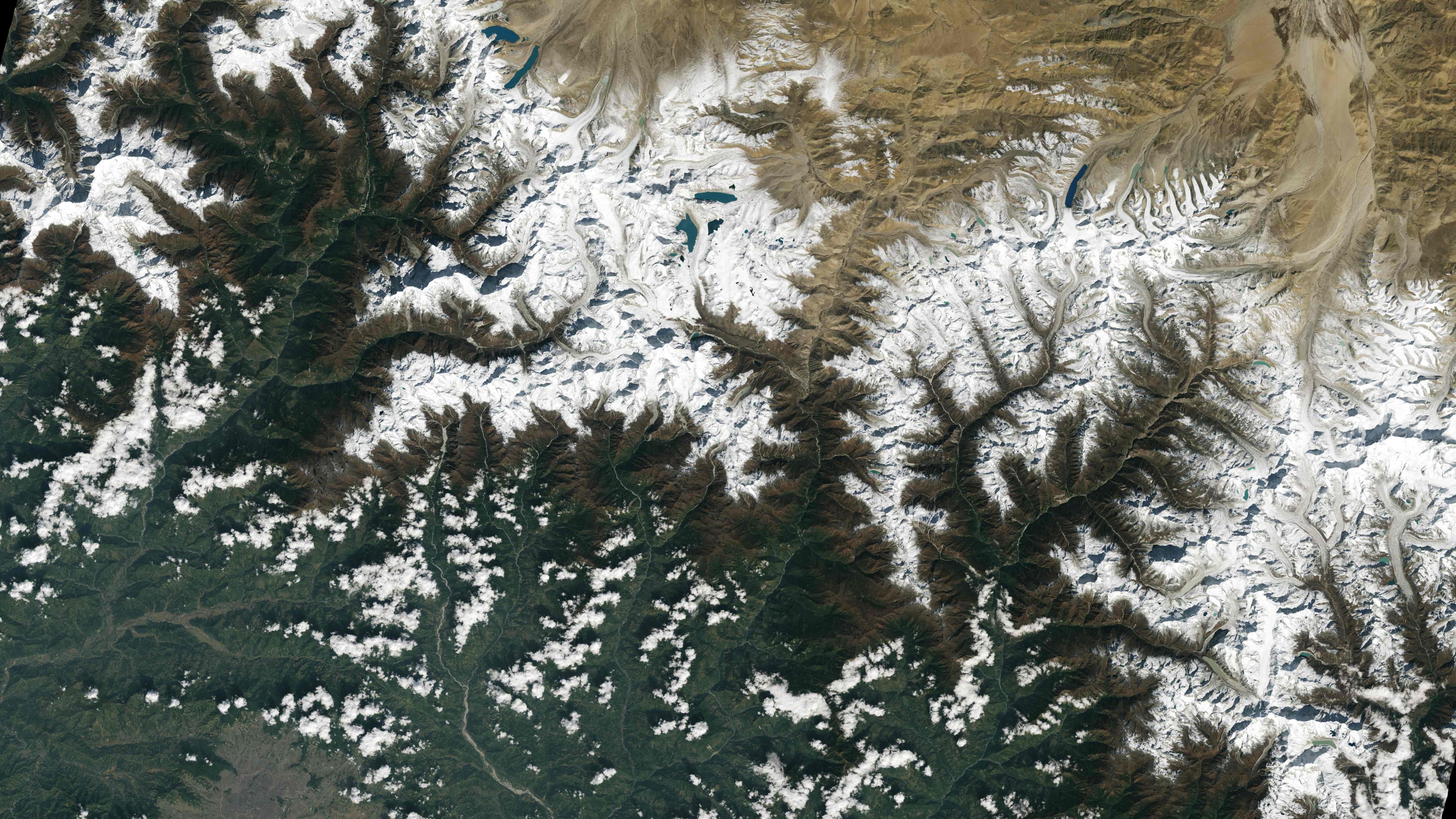 This image collected by Landsat 9 on October 31, 2021 and released by NASA, shows the city of Kathmandu, Nepal, seen at the bottom left, lies in a valley south of the Himalayan Mountains between Nepal and China. - Glaciers, and the lakes formed by glacial meltwater, are visible in the top middle of this image. In High Mountain Asia, many communities rely on meltwater from glaciers � and Landsat can help track how those glaciers are changing in a warming climate. Previous studies with Landsat have documented shrinkage of Himalayan glaciers, as well as changing lake levels the adjacent Tibetan plateau. (Photo by Handout / various sources / AFP) This image collected by Landsat 9 on October 31, 2021 and released by NASA, shows the city of Kathmandu, Nepal, seen at the bottom left, lies in a valley south of the Himalayan Mountains between Nepal and China. - Glaciers, and the lakes formed by glacial meltwater, are visible in the top middle of this image. In High Mountain Asia, many communities rely on meltwater from glaciers � and Landsat can help track how those glaciers are changing in a warming climate. Previous studies with Landsat have documented shrinkage of Himalayan glaciers, as well as changing lake levels the adjacent Tibetan plateau. (Photo by Handout / various sources / AFP) 
