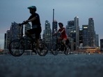 Cyclists pass the city skyline during the coronavirus disease (COVID-19) outbreak, in Singapore(REUTERS) Cyclists pass the city skyline during the coronavirus disease (COVID-19) outbreak, in Singapore(REUTERS)
