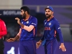 India's Jasprit Bumrah, left, celebrates the dismissal of Scotland's captain Kyle Coetzer with captain Virat Kohli during the Cricket Twenty20 World Cup match between India and Scotland in Dubai, UAE, Friday, Nov. 5, 2021. (AP) India's Jasprit Bumrah, left, celebrates the dismissal of Scotland's captain Kyle Coetzer with captain Virat Kohli during the Cricket Twenty20 World Cup match between India and Scotland in Dubai, UAE, Friday, Nov. 5, 2021. (AP)
