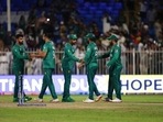 Pakistan players greet each other after their win in the Cricket Twenty20 World Cup match against Scotland in Sharjah, UAE, Sunday, Nov. 7, 2021. (AP)