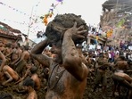Men fling cow dung at each other during the annual 'Gore Habba' festival, where people throw and smear each other with cow dung, in Gumatapura village in Karnataka.(AFP Photo) Men fling cow dung at each other during the annual 'Gore Habba' festival, where people throw and smear each other with cow dung, in Gumatapura village in Karnataka.(AFP Photo)