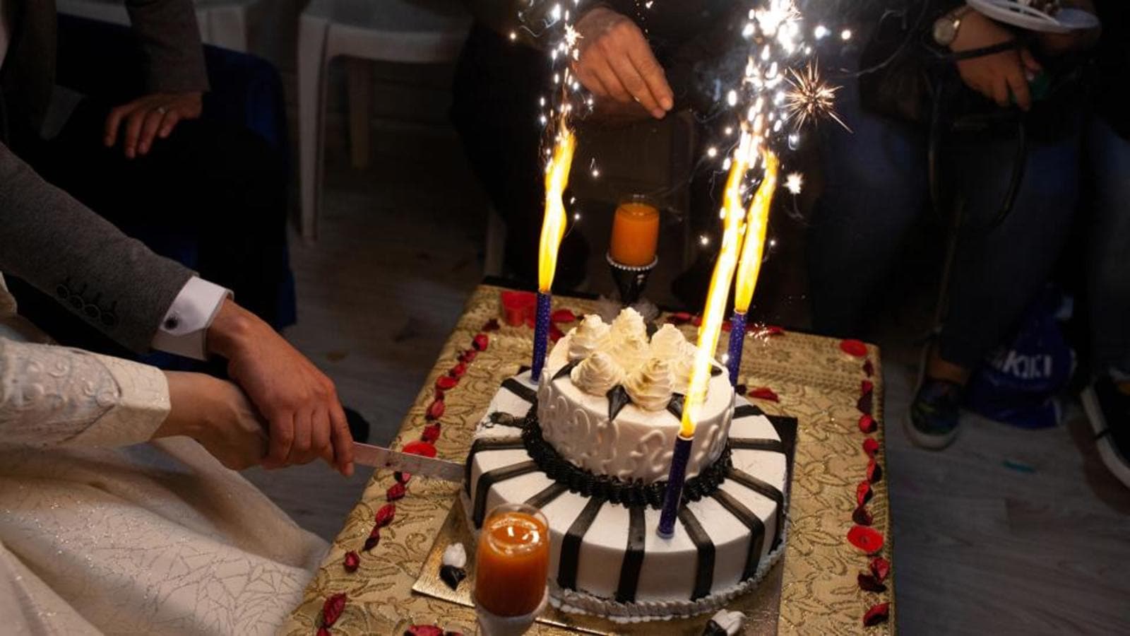 Disturbing reason why newlyweds cut their wedding cake in front of everyone  on their special day - Mirror Online