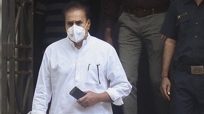 Former Maharashtra Home minister Anil Deshmukh being taken to special court for remand by ED officials in Mumbai on Saturday. (PTI) Former Maharashtra Home minister Anil Deshmukh being taken to special court for remand by ED officials in Mumbai on Saturday. (PTI)