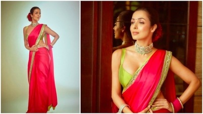 Malaika Arora is the epitome of grace and elegance in this gorgeous pink saree with green and silver borders. (Instagram/@malaikaaroraofficial)