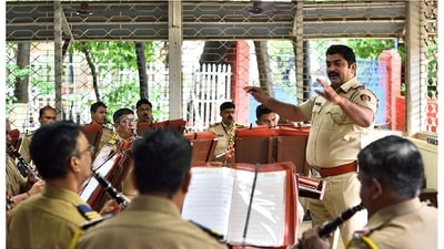 Bandmaster Sanjay Kalyani, who joined the Mumbai Police after retiring from the Indian Navy after fifteen years of service, conducts a practice session for the Mumbai Police Band. “It is important to retain diversity in music. In March this year, we took all precautions and got together to practice and record music," said Kalyani. (Photo by Satish Bate/Hindustan Times)
