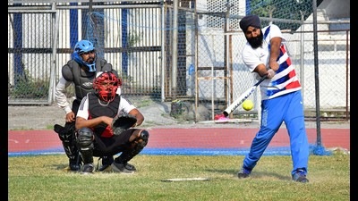 Players in action during the Senior State Softball Championship at Guru Nanak Stadium in Ludhiana on Sunday. (Harsimar Pal Singh/HT)