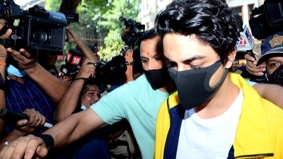 Aryan Khan appears before Narcotics Control Bureau as per the conditions set by Bombay High Court while granting him bail in the drugs-on-cruise case, in Mumbai on Friday. (ANI Photo) Aryan Khan appears before Narcotics Control Bureau as per the conditions set by Bombay High Court while granting him bail in the drugs-on-cruise case, in Mumbai on Friday. (ANI Photo)