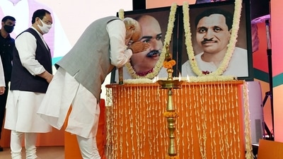 Prime Minister Narendra Modi pays homage to Jana Sangh leader Deen Dayal Upadhyaya and Syama Prasad Mukherjee during the BJP National Executive meeting, at the NDMC Convention centre, in New Delhi on Sunday.&nbsp; (ANI)