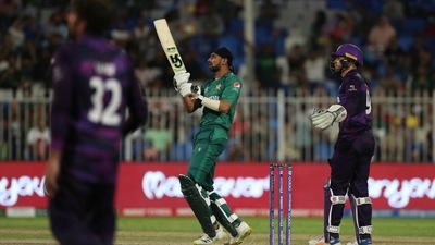 Pakistan's Shoaib Malik, center, watches his shot during the Cricket Twenty20 World Cup match between Pakistan and Scotland in Sharjah, UAE, Sunday, Nov. 7, 2021. (AP) Pakistan's Shoaib Malik, center, watches his shot during the Cricket Twenty20 World Cup match between Pakistan and Scotland in Sharjah, UAE, Sunday, Nov. 7, 2021. (AP)