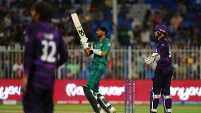 Pakistan's Shoaib Malik, center, watches his shot during the Cricket Twenty20 World Cup match between Pakistan and Scotland in Sharjah. (AP)