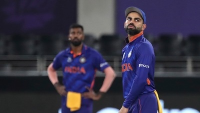 India's captain Virat Kohli reacts to a boundary hit by New Zealand's Daryl Mitchell during the Cricket Twenty20 World Cup match between New Zealand and India in Dubai, UAE, Sunday, Oct. 31, 2021. (AP)