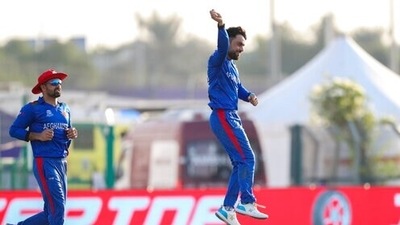 Afghanistan's Rashid Khan celebrates after taking the wicket of New Zealand's Martin Guptill during the Cricket Twenty20 World Cup match between New Zealand and Afghanistan in Abu Dhabi, UAE, Sunday, Nov. 7, 2021. (AP Photo/Kamran Jebreili) (AP) Afghanistan's Rashid Khan celebrates after taking the wicket of New Zealand's Martin Guptill during the Cricket Twenty20 World Cup match between New Zealand and Afghanistan in Abu Dhabi, UAE, Sunday, Nov. 7, 2021. (AP Photo/Kamran Jebreili) (AP)