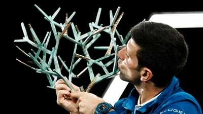 Serbia's Novak Djokovic kisses his trophy after defeating Russia's Daniil Medvedev in the final match of the Paris Masters tennis tournament at the Accor Arena in Paris, Sunday, Nov.7, 2021. Djokovic won 4-6, 6-3, 6-3. (AP) Serbia's Novak Djokovic kisses his trophy after defeating Russia's Daniil Medvedev in the final match of the Paris Masters tennis tournament at the Accor Arena in Paris, Sunday, Nov.7, 2021. Djokovic won 4-6, 6-3, 6-3. (AP)