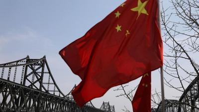 A Chinese national flag flutters near the Friendship Bridge and Broken Bridge over the Yalu River, which separates North Korea’s Sinuiju from China, in Dandong, Liaoning province, China. A Canadian apparel company has cancelled a contract with a Chinese supplier and removed products from that source after a media expose showed that it was using forced North Korean labour. A Chinese national flag flutters near the Friendship Bridge and Broken Bridge over the Yalu River, which separates North Korea’s Sinuiju from China, in Dandong, Liaoning province, China. A Canadian apparel company has cancelled a contract with a Chinese supplier and removed products from that source after a media expose showed that it was using forced North Korean labour.