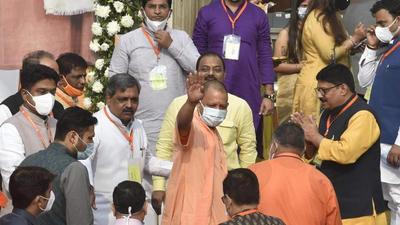 Uttar Pradesh chief minister Yogi Adityanath arrives to attend the BJP national executive meet in New Delhi on Sunday. (PTI)