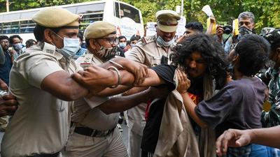 Security personnel detain All India Students Association (AISA) activists and other student’s unions as they take part in a protest in New Delhi on October 29 against recent incidents of violence in Tripura. (AFP) Security personnel detain All India Students Association (AISA) activists and other student’s unions as they take part in a protest in New Delhi on October 29 against recent incidents of violence in Tripura. (AFP)