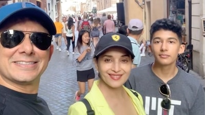 Madhuri Dixit poses in Italy with her husband, Dr Shriram Nene, and their son Arin. Madhuri Dixit poses in Italy with her husband, Dr Shriram Nene, and their son Arin.