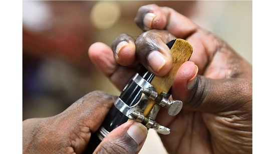 A member of the Mumbai Police Band adjusts the reed on his wind instrument during a practice session in Mumbai. “Music is medicine, especially in the pandemic where people need to be motivated to feel happy and go to work safely. That’s what Khaki Studio is for,” said Sanjay Kalyani, bandmaster of the Mumbai Police Band.&nbsp;(Photo by Satish Bate/Hindustan Times)