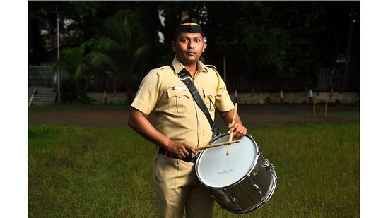 Swastik Sawant, member of the Mumbai Police Band, also known as “Khaki Studio” on YouTube, with his side drum, after a practice session in Naigaon, Mumbai.(Photo by Satish Bate/Hindustan Times)