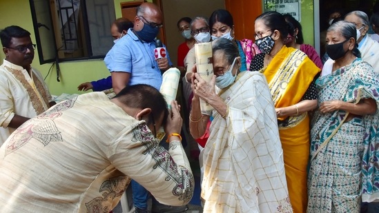 West Bengal Power, Youth Services, and Sports Minister Aroop Biswas greets an elderly woman on Bhai Dooj, at an old age home, in Kolkata.(ANI)