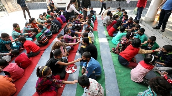 Orphan girls perform Tika ceremony on the boy's forehead on the occasion of Bhai Dooj at Ved Mandir, in Jammu.(ANI)