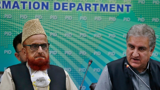 Pakistan's Foreign Minister Shah Mahmood Qureshi, right, and top religious leader Mufti Muneebur Rehman, who helped negotiate an end to a protest mach by Islamists, give a press conference, in Islamabad, Pakistan (AP). Pakistan's Foreign Minister Shah Mahmood Qureshi, right, and top religious leader Mufti Muneebur Rehman, who helped negotiate an end to a protest mach by Islamists, give a press conference, in Islamabad, Pakistan (AP).