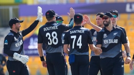 New Zealand's Trent Boult, third right, is congratulated by teammates after taking the wicket of Afghanistan's Hazratullah Zazai during the Cricket Twenty20 World Cup match between New Zealand and Afghanistan in Abu Dhabi, UAE, Sunday, Nov. 7, 2021. (AP Photo/Kamran Jebreili)(AP)