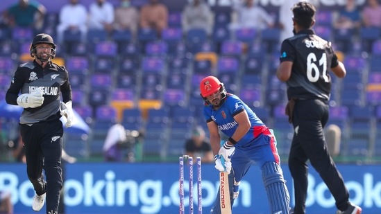 Afghanistan's Gulbadin Naib, centre, reacts after he was dismissed by New Zealand's Ish Sodhi, right, during the Cricket Twenty20 World Cup match between New Zealand and Afghanistan in Abu Dhabi, UAE, Sunday, Nov. 7, 2021. (AP Photo/Kamran Jebreili)(AP)