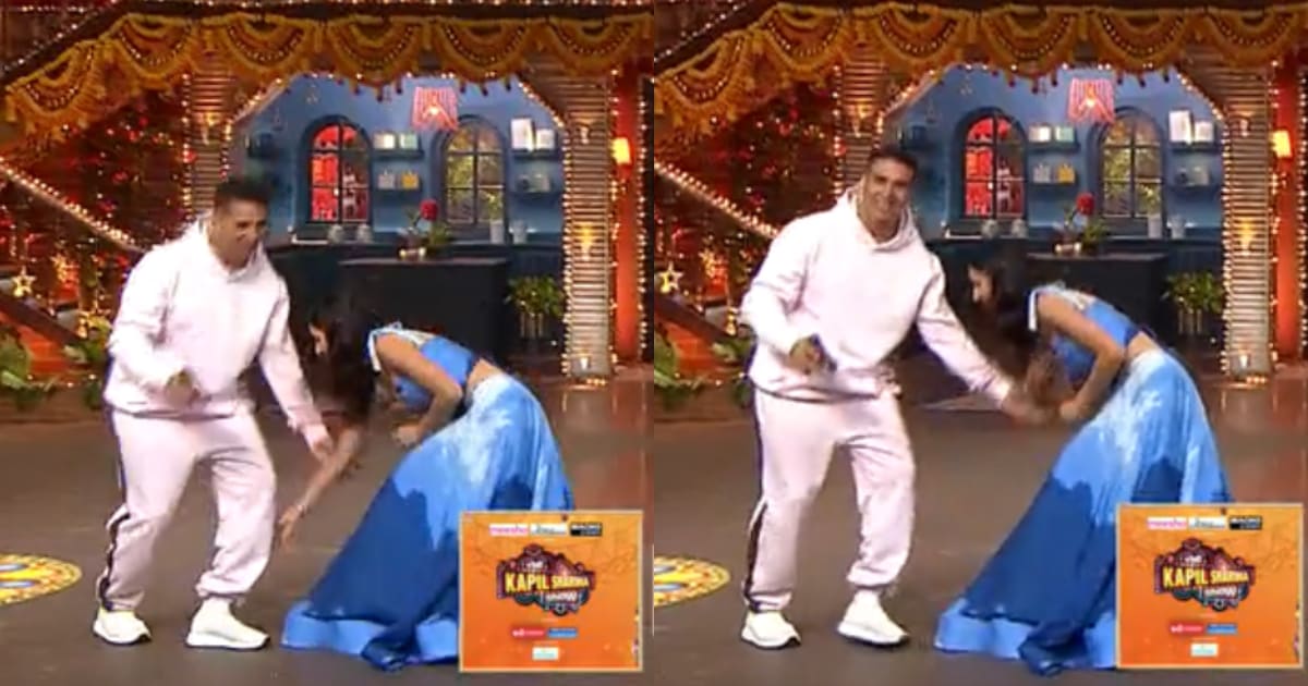 Katrina Kaif touches Akshay Kumar's feet on The Kapil Sharma Show. Katrina Kaif touches Akshay Kumar's feet on The Kapil Sharma Show.