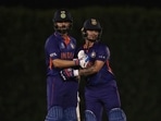 India's captain Virat Kohli, left, congratulates teammate Ishan Kishan on scoring fifty runs during the Cricket Twenty20 World Cup warm-up match between India and England in Dubai, UAE, Monday, Oct. 18, 2021.(AP) India's captain Virat Kohli, left, congratulates teammate Ishan Kishan on scoring fifty runs during the Cricket Twenty20 World Cup warm-up match between India and England in Dubai, UAE, Monday, Oct. 18, 2021.(AP)