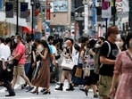 People walk at a crossing in Shibuya shopping area, amid the coronavirus disease (Covid-19) pandemic, in Tokyo(Reuters photo) People walk at a crossing in Shibuya shopping area, amid the coronavirus disease (Covid-19) pandemic, in Tokyo(Reuters photo)
