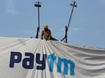 Paytm aims to raise <span class='webrupee'>₹</span>18,300 crore at a band of <span class='webrupee'>₹</span>2,080-2,150, valuing the company at <span class='webrupee'>₹</span>1.39 trillion at the top end.(REUTERS) Paytm aims to raise <span class='webrupee'>₹</span>18,300 crore at a band of <span class='webrupee'>₹</span>2,080-2,150, valuing the company at <span class='webrupee'>₹</span>1.39 trillion at the top end.(REUTERS)