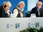 (L-R) Britain's Prime Minister Boris Johnson, India's Prime Minister Narendra Modi, Australia's Prime Minister Scott Morrison at a session on the second day of the COP26 UN Climate Summit in Glasgow.