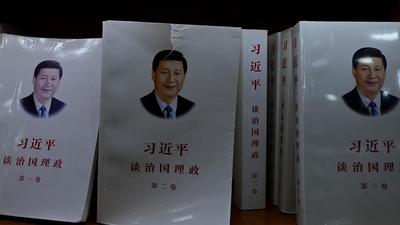 Books on Chinese President Xi Jinping are on display at a store in Beijing on Monday. A summit of the Communist party is being held behind closed doors as Xi Jinping looks to secure both his legacy and future as China’s leader for a third term in 2022. (AFP)